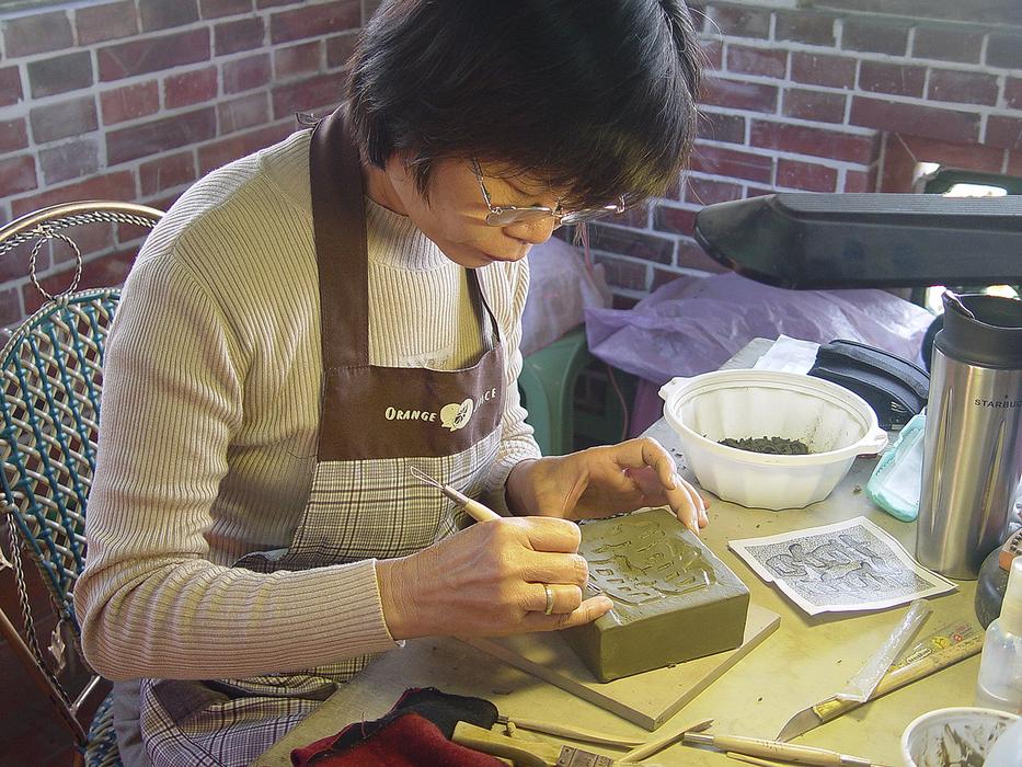 Woman working at the table in Kaohsiung, Taiwan