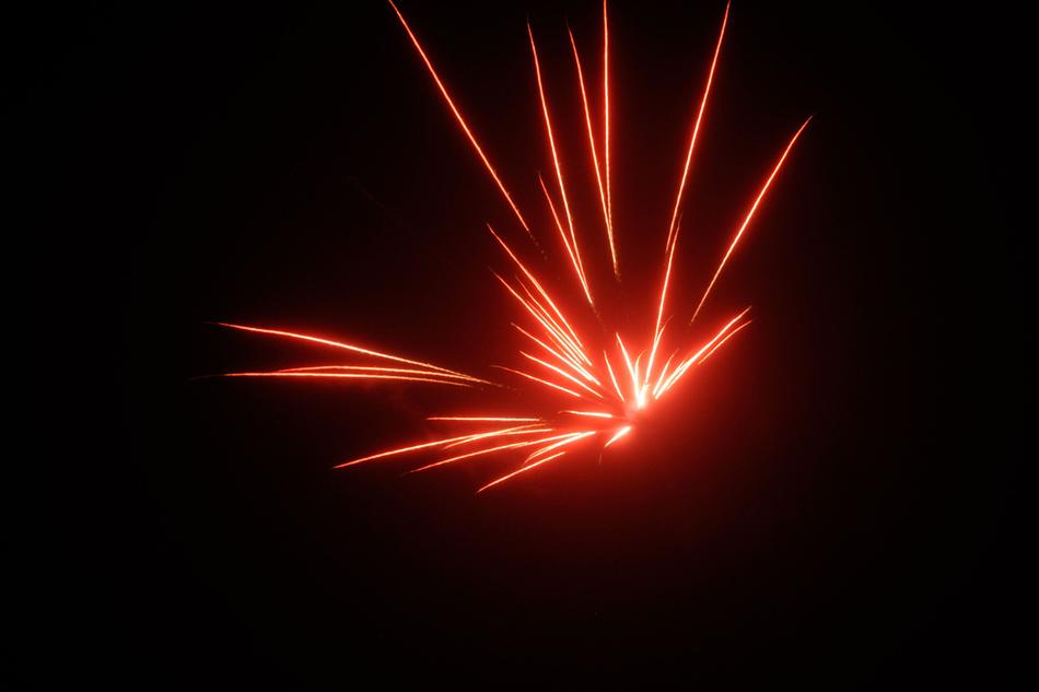 red fireworks in a black sky.