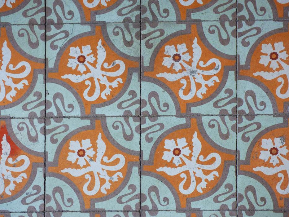 a colored pattern on an old wall