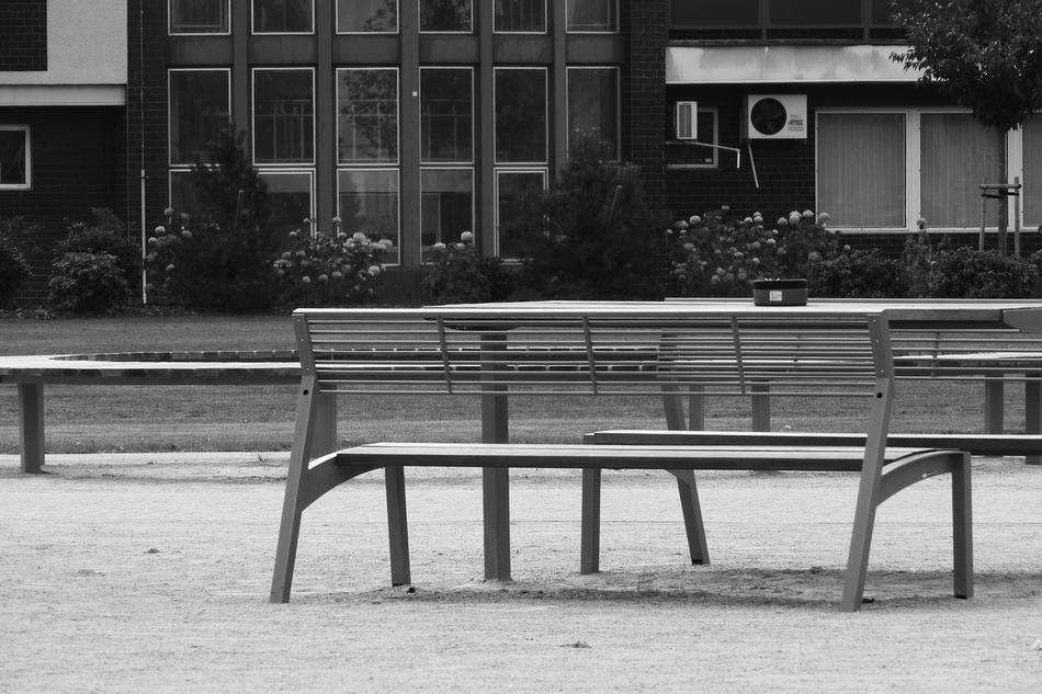 a bench with a bench outside the house