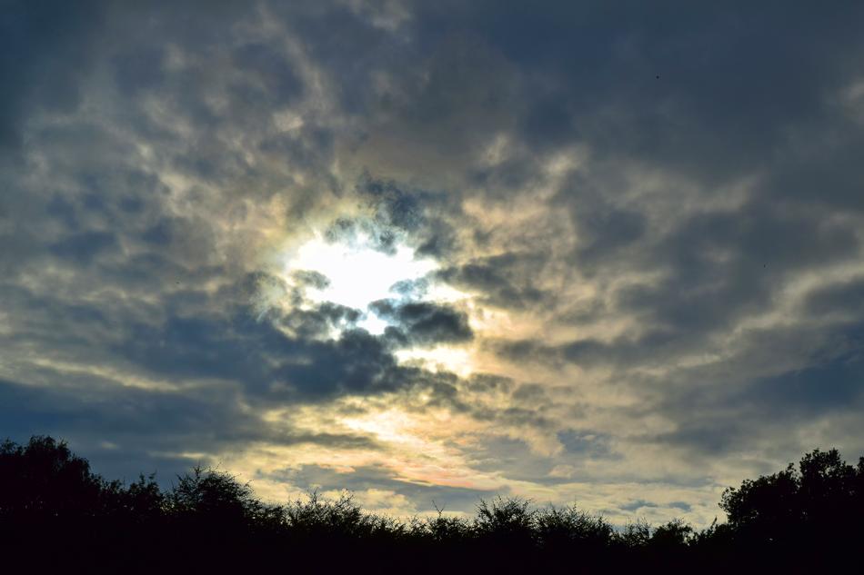 cloudy sky with the sun