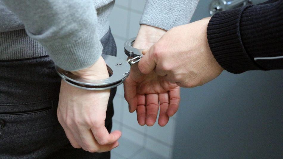 the handcuffed man is in custody