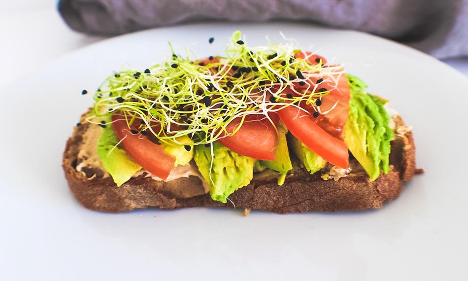 sandwich with avocado, tomato and herbs