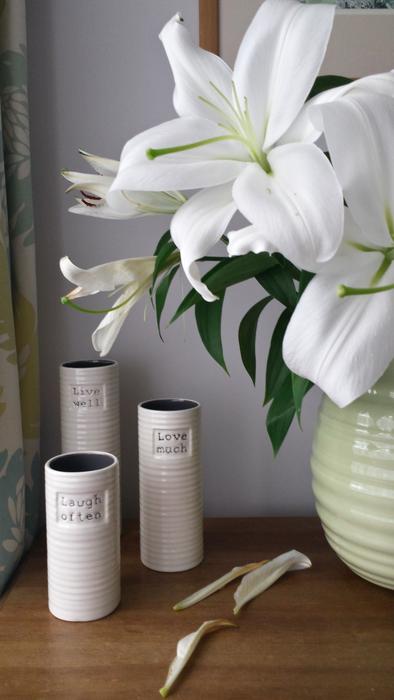 Are they white and in a vase on the table