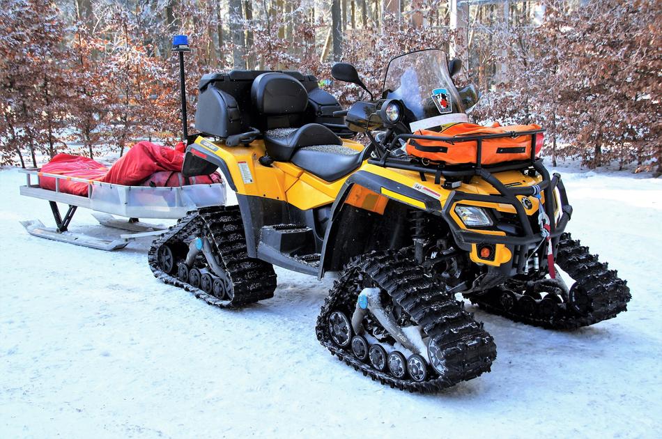 yellow vehicle in the snow