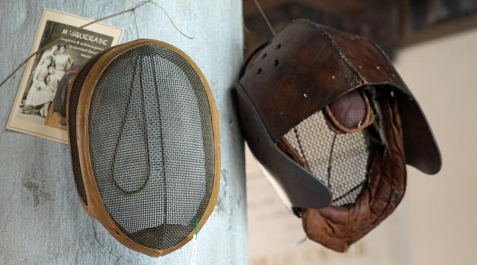 a sieve and a hat on the wall