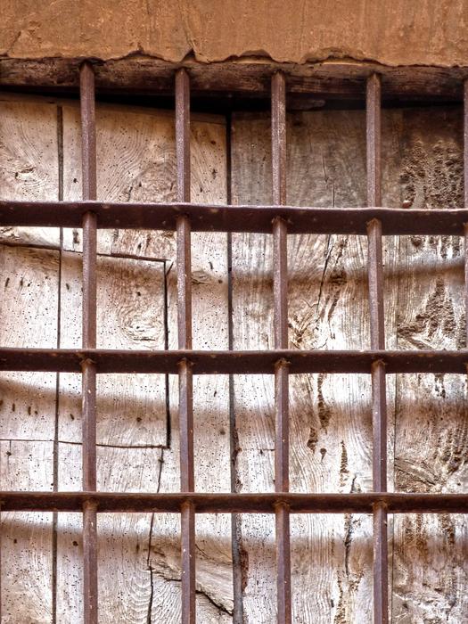 an iron fence with a window