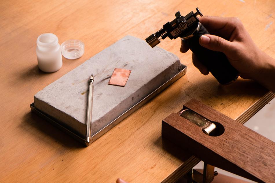 table with a hand and objects