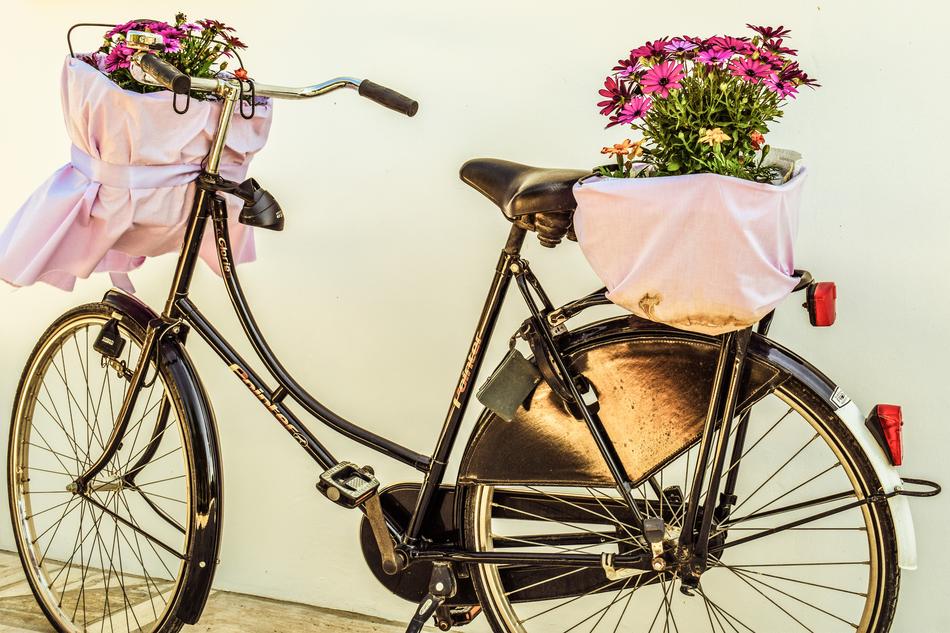 the bicycle with the flowers is beautiful