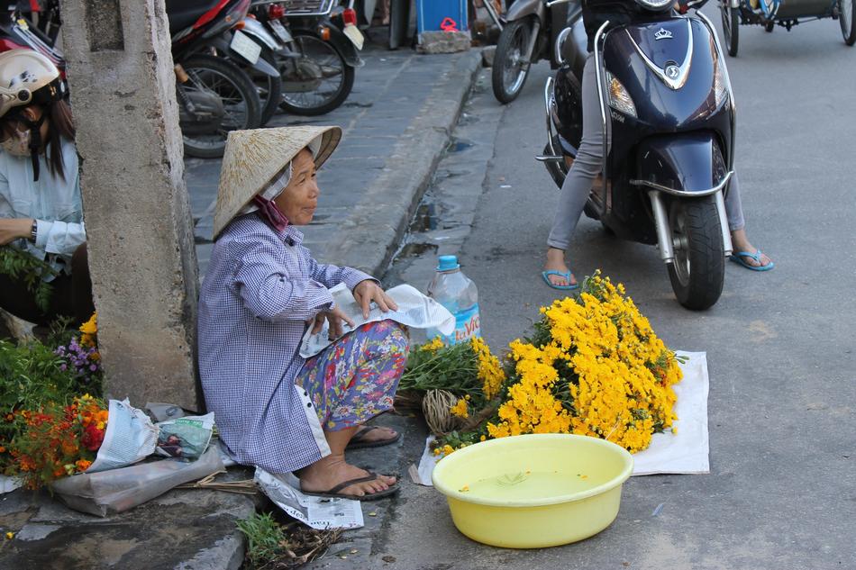 grandmother with flowers at the market
