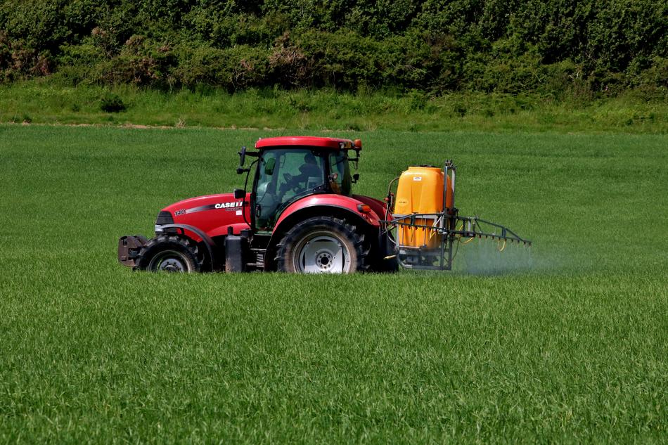 tractor on green grass working