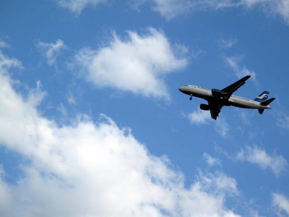 airplane against a cloudy sky
