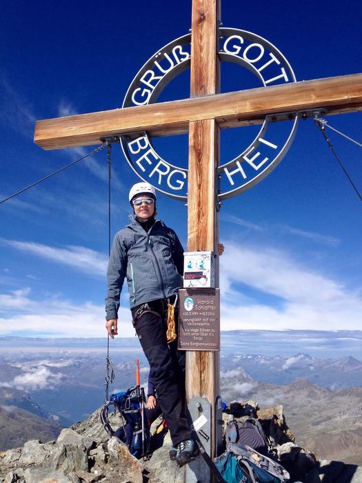 man at the cross against the sky