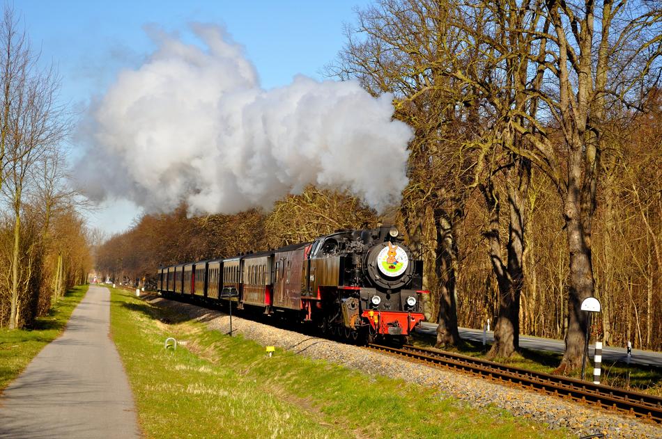 A train going down the road into the distance
