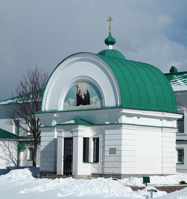 green-roofed church in the snow