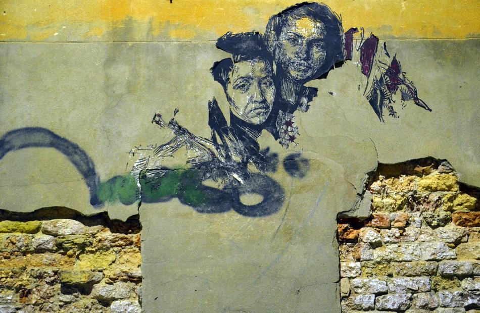 drawing of a girl and a man on the wall