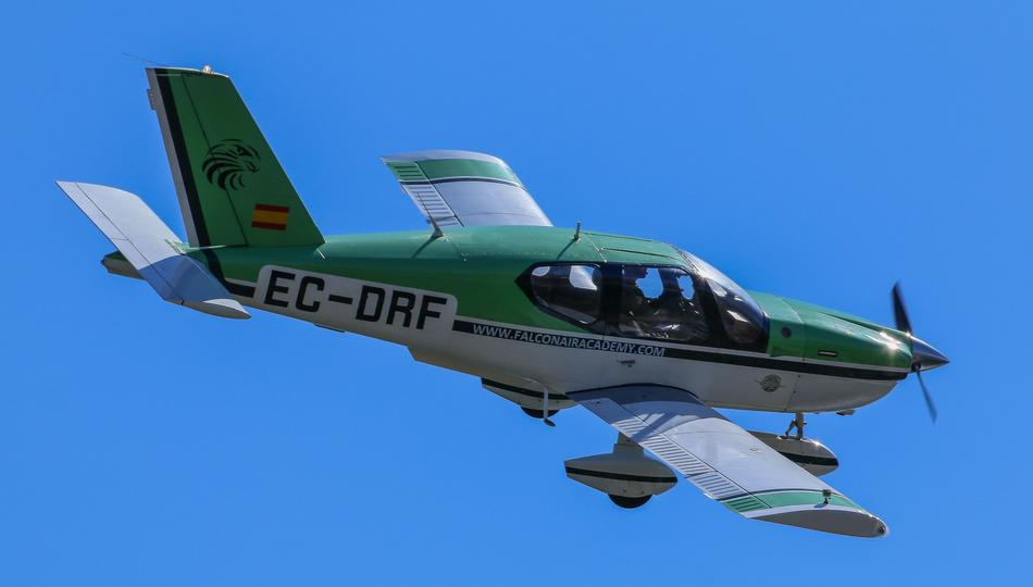 A flying helicopter in the blue sky