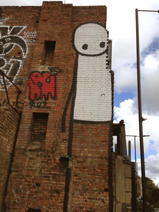 man graffiti wall