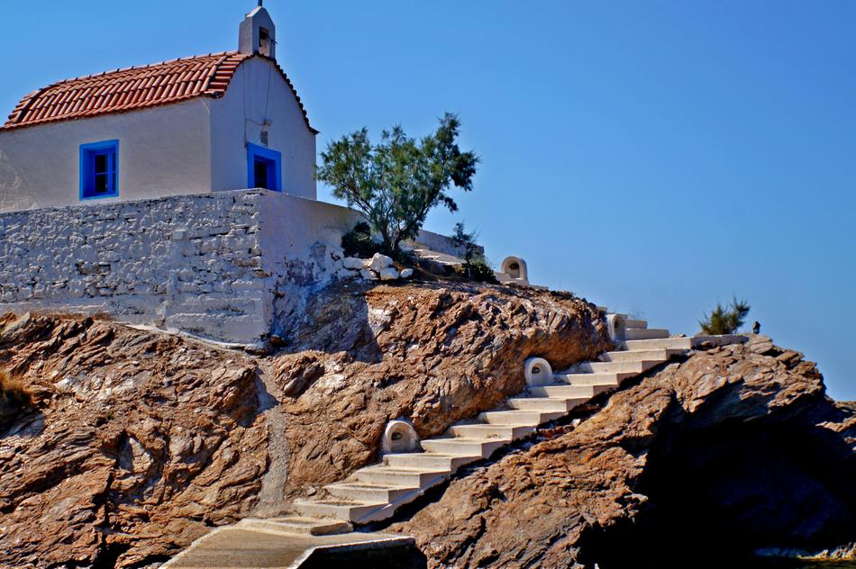 a high cliff with a house