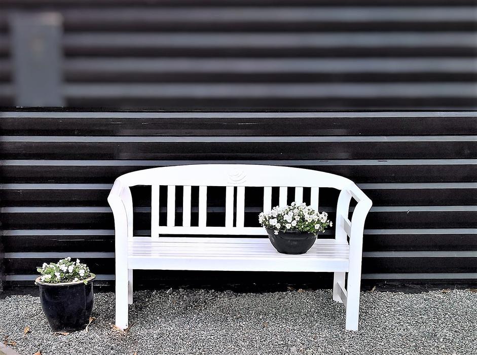 white bench with flowers