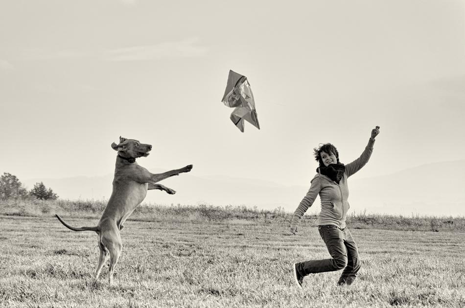 The girl is happy with the dog