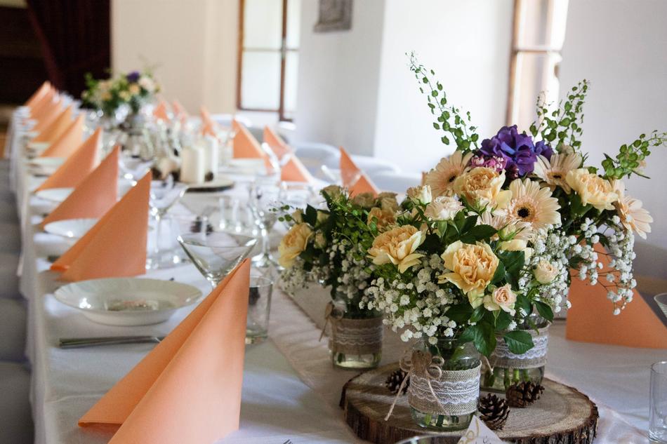 flowers in a vase napkins plates