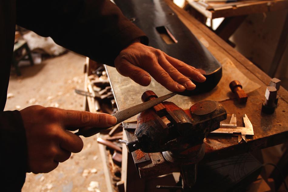 a man sharpening a knife
