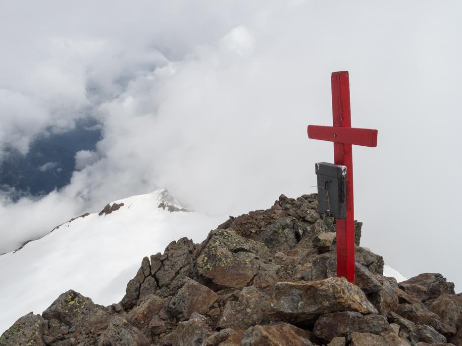 a red cross high in the mountains