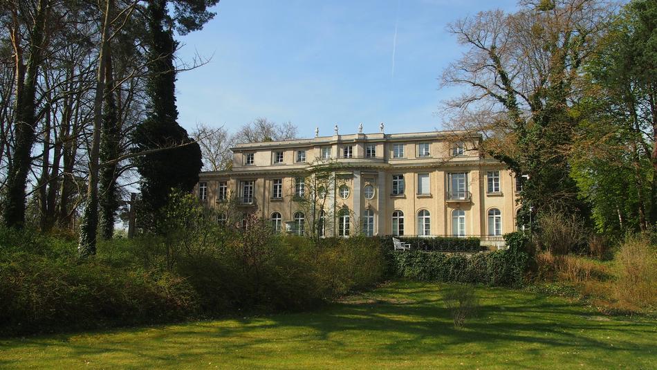 a beautiful building in the grass