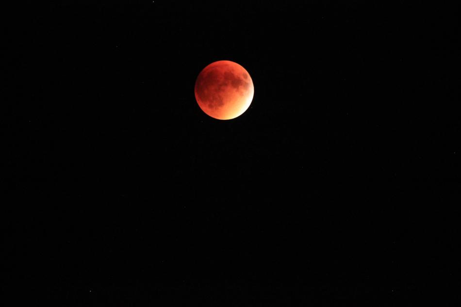 red moon in a black sky