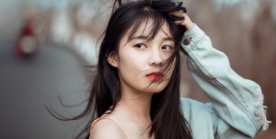 The Asian girl has a beautiful smile