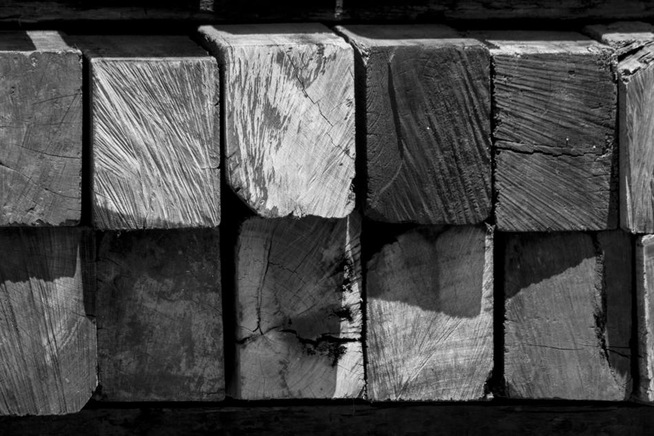 wooden pillars in black background