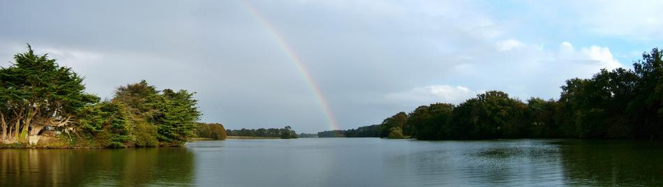 A distant rainbow over the river