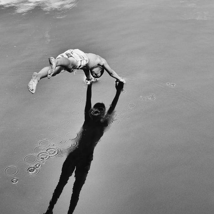 Baby in the water having fun