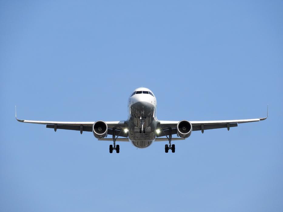 a plane in the blue sky