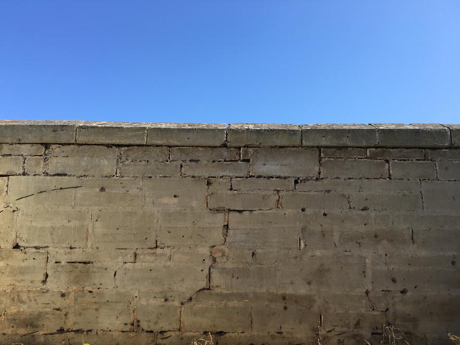 A stone wall in the blue sky