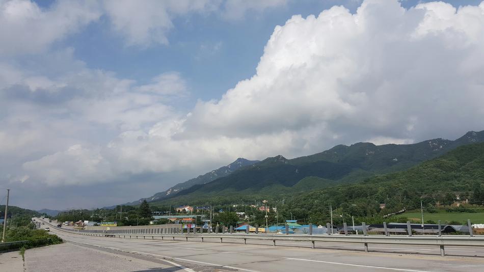 the landscape of the mountains by the road