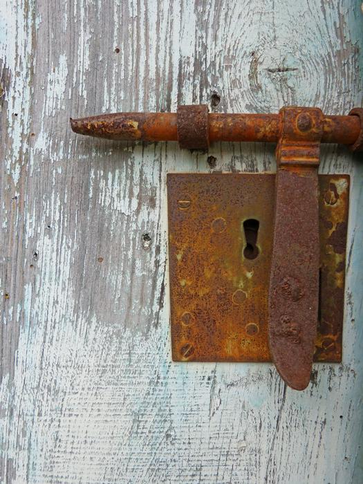 the door with a rusty lock
