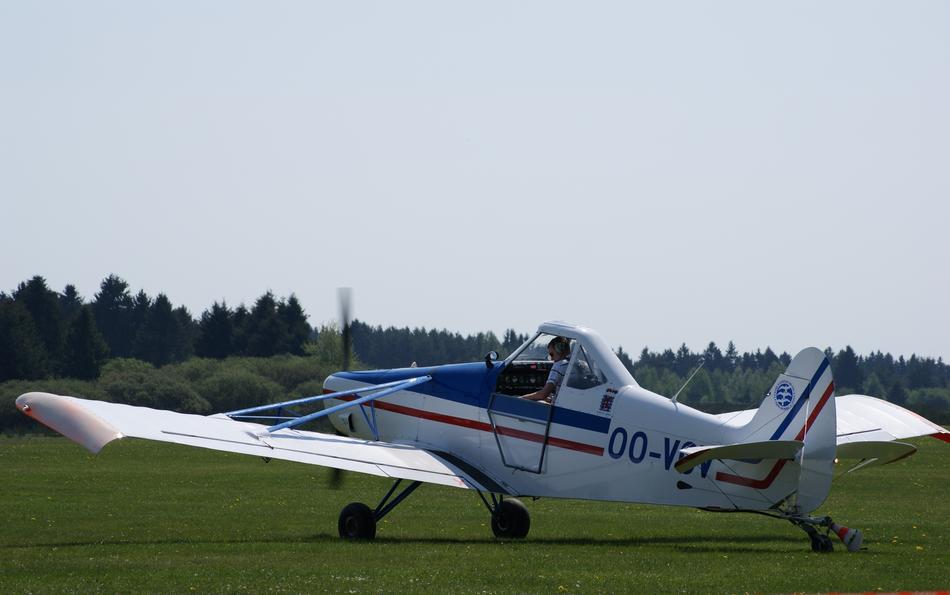 an airplane on the grass in a field