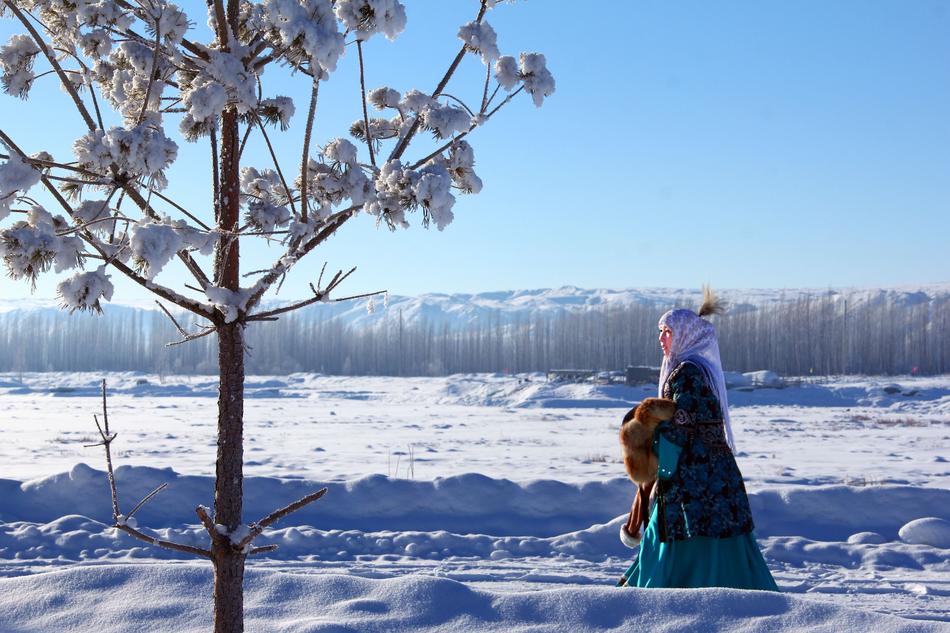 a girl walks in the snow