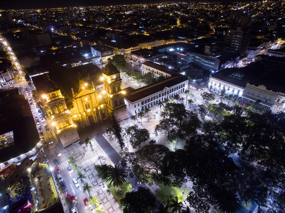 an aerial view of the burning city in lights