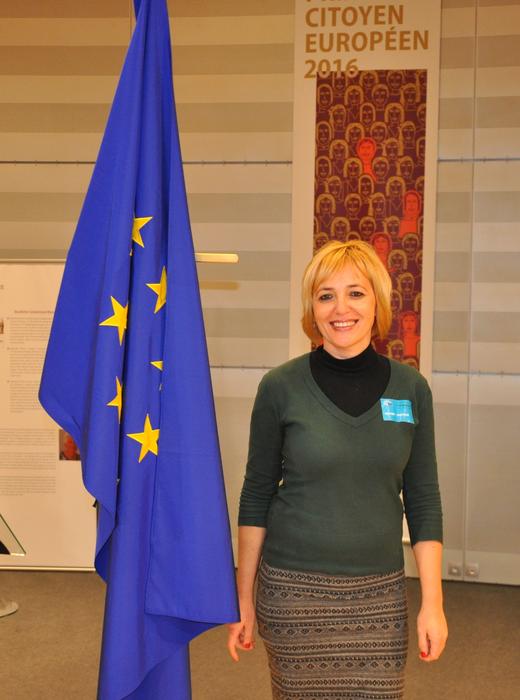 a girl near the flag of Europe