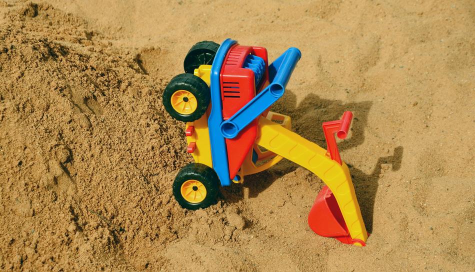 sand mountain with a baby tractor