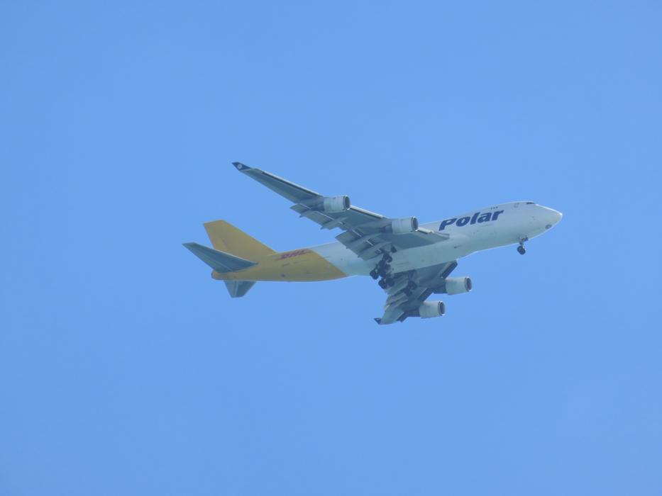 white airplane in a blue sky