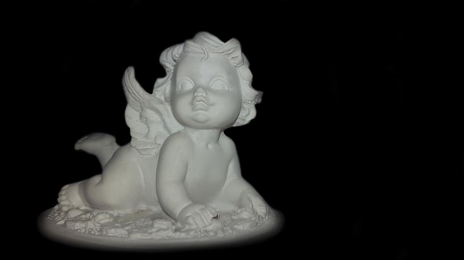 little angel on a black background