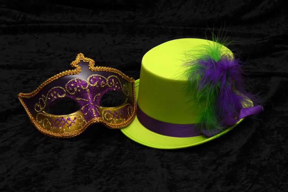 green hat with a mask on a black background