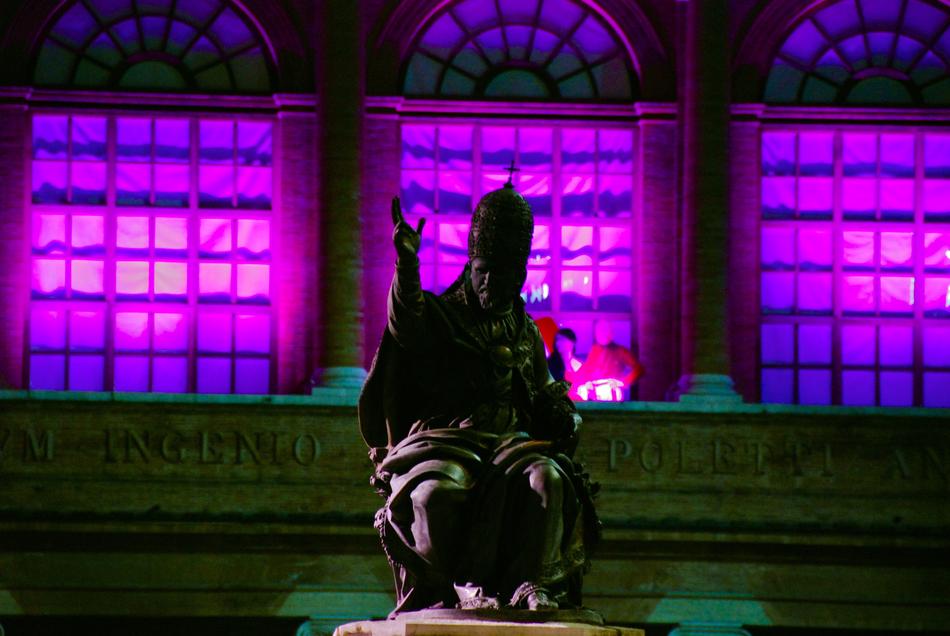 sculpture against the pink windows