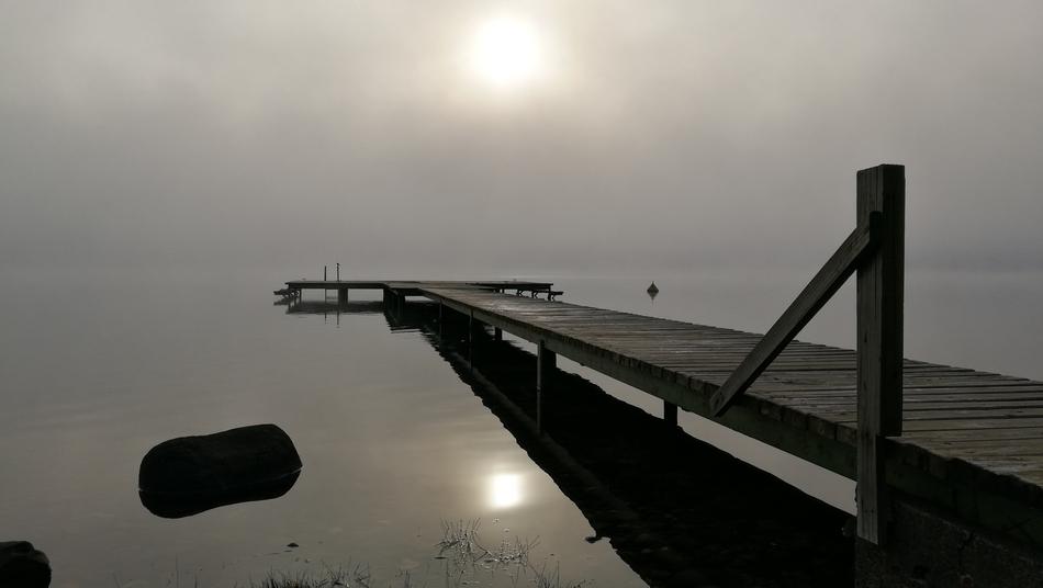 Rybatsky bridge in the lake