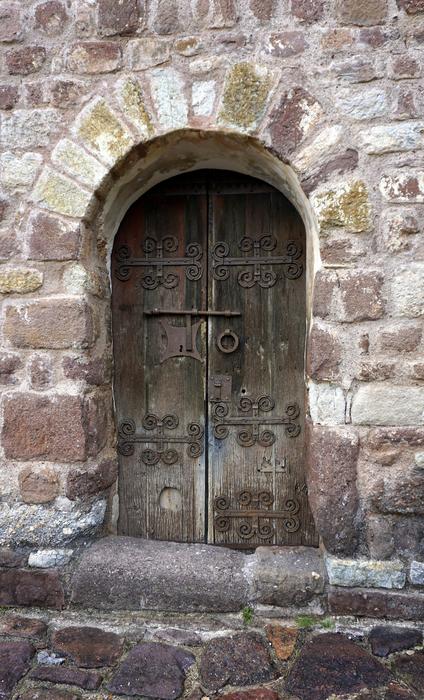 wooden door in a stone castle