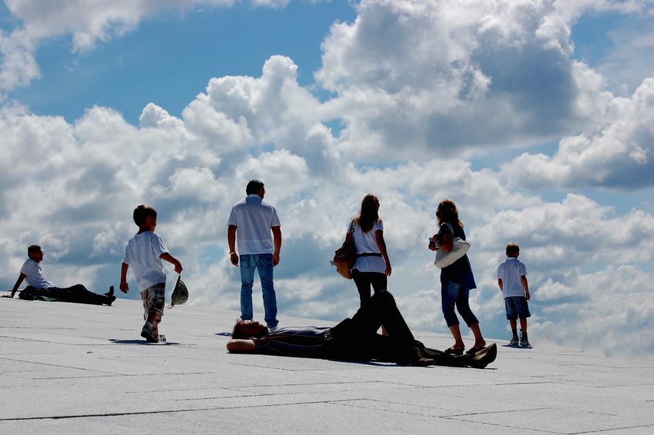 tourists relax against the background of a cloudy sky